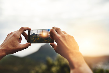 Image showing Sunset, photography and hands of person with phone, screen and social media post of nature, landscape or sun. Cellphone, photo or man with tech for memory of vacation, holiday or outdoor view