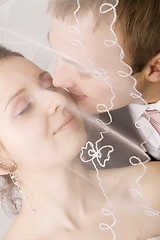 Image showing Bride and groom kissing