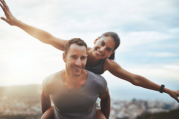 Image showing Portrait, piggy back and couple with happiness, outdoor and lens flare with freedom, love and adventure. Face, man carrying woman and journey with health, fun and outside with wellness and vacation