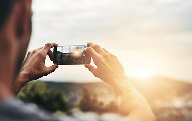 Image showing Sunset, photography and hands of man with phone, screen and post on social media with nature, landscape or sun. Cellphone, photo and person with tech for memory of vacation, holiday or outdoor view