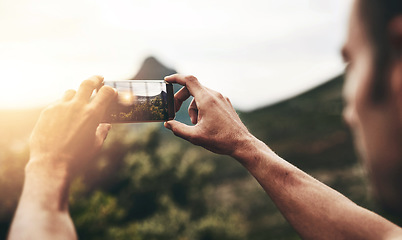 Image showing Sunset, photography and hands of man with phone, screen and post on social media with nature, landscape or sun. Cellphone, photo and person with tech for memory of vacation, holiday or mountain view