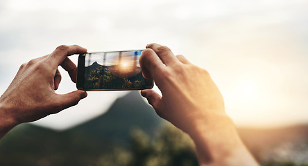 Image showing Sunset, photography and hands of person with phone, screen or post on social media with nature, landscape or sun. Cellphone, photo or man with tech for memory of vacation, holiday or view of mountain