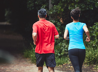 Image showing Couple, back and running in park for exercise and health outdoor, support and training for marathon with cardio. Runner, athlete and sport with people in nature, challenge and fitness with workout