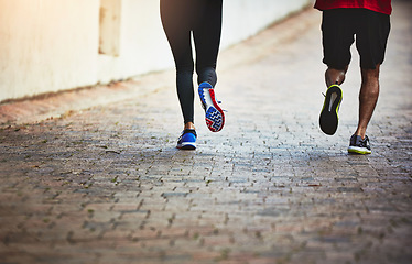 Image showing Legs, couple are running together and fitness, exercise and training for marathon with bonding and sports. People workout, cardio on outdoor path for health and wellness with runner and challenge