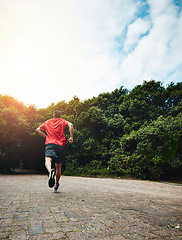 Image showing Man in park, back and running for fitness in nature, exercise and training for marathon with athlete and sports. Runner, speed and challenge in workout, cardio outdoor for health with sky mockup