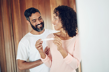 Image showing Couple, happy and positive pregnancy test at home, hug and excited for family, future and love. Smiling parents, success and pregnant by ivf, fertility and support, results and celebration for baby