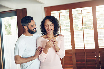 Image showing Couple, excited and positive pregnancy test at home, hug and happy for future, support and love. Smiling people, success and pregnant by ivf, fertility and good news, results and celebration for baby