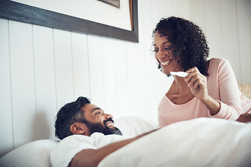 Image showing Couple, surprise and happy with pregnancy test, positive and bed with smile, results and excited. Man, woman and baby with stick, love and maternity for future family, bedroom and pregnant together