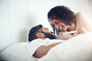 Image showing Couple, happy and laughter with pregnancy test, positive and bed with smile, results and excited. Man, woman and baby with stick, love and maternity for future family, surprise and pregnant together