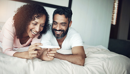 Image showing Couple, happy and bedroom with pregnancy test, positive and bed with smile, results and excited. Man, woman and baby with stick, love and maternity for future family, surprise and pregnant together