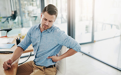 Image showing Man, stretching and back pain from chair in office with stress, anxiety or frustrated with injury to muscle. Tired, employee and strain on spine in workplace with fatigue or problem in health