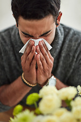 Image showing Spring, blowing nose with a man using a tissue closeup in his home for relief from allergy symptoms. Face, cold or flu and a young person sick with a virus due to pollen or hay fever at home