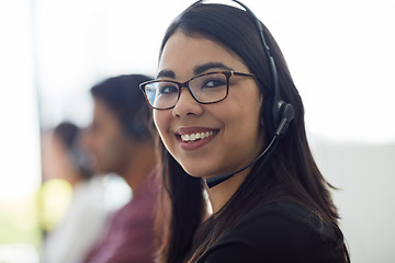 Image showing Business woman, call center portrait and happy for customer service, e commerce sales and telemarketing. Face of professional consultant or agent in telecom workspace for contact us or virtual chat