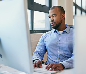 Image showing Business, thinking and black man with a computer, internet and solution with problem solving, planning and ideas. African person, employee and worker with tech, laptop and brainstorming with typing