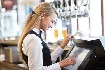 Image showing Cashier, barista and young woman waitress in cafe checking for payment receipt. Hospitality, server and female butler from Canada preparing a slip at the till by a bar in coffee shop or restaurant.