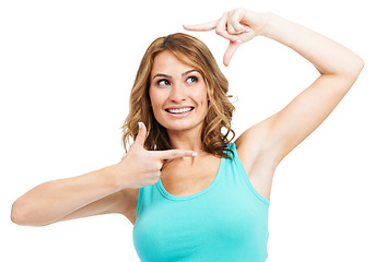 Image showing Happy, woman and finger frame in studio to review profile picture on white background. Model, smile and thinking of perspective for photography ideas, planning selfie and hand sign to border face