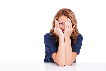 Image showing Peeking, woman and shy in studio for secret, surprise or hiding face on white background on mock up space. Person, girl and hands closing, hide or cover eye for shame, curious or insecure expression