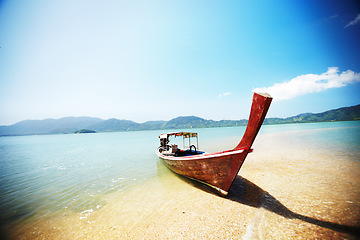 Image showing Boat, transport and travel, beach and ocean with landscape and paradise, tropical island background with nature and vacation. Holiday in Thailand with transportation, sea vessel and outdoor adventure
