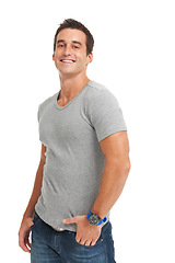 Image showing Portrait, fashion and smile with a man in studio isolated on a white background for classic style. Happy, confident and a trendy young model looking strong in a t-shirt or masculine clothes outfit