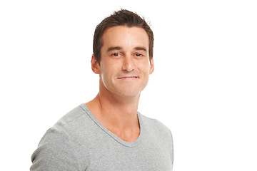 Image showing Portrait, happy and a confident man in studio isolated on a white background for fashion or style. Smile, wellness and satisfaction with a young model looking relaxed in a casual clothes outfit