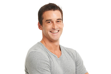 Image showing Portrait, smile and a confident man in studio isolated on a white background for fashion or style. Happy, wellness and satisfaction with a young model looking relaxed in a casual clothes outfit