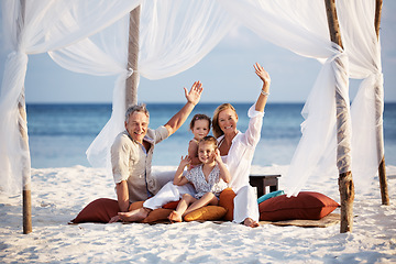 Image showing Portrait, wave and family with vacation, beach and relax with adventure, travel and tourism. Face, parents and mother with father, children and seaside holiday with gesture, tent and summer break