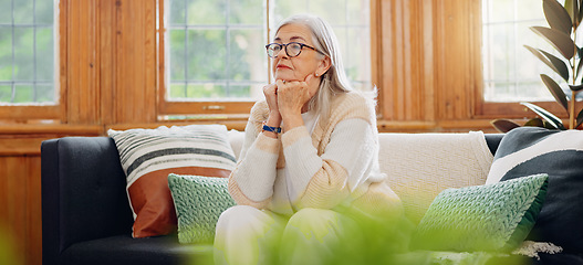 Image showing Thinking, reflection and senior woman on sofa in the living room with memory or dreaming face. Relax, idea and elderly female person in retirement with alzheimers disease in the lounge of modern home