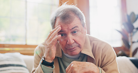 Image showing Thinking, stress and senior man on sofa in the living room with memory or reflection face expression. Relax, idea and elderly male person in retirement with dementia disease in lounge of modern home.