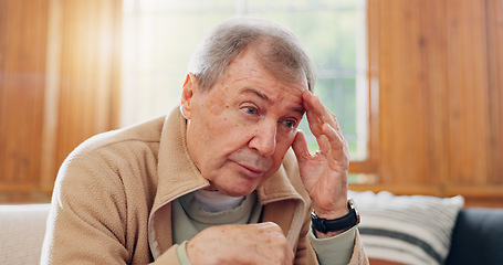 Image showing Thinking, stress and senior man on sofa in the living room with memory or reflection face expression. Relax, idea and elderly male person in retirement with dementia disease in lounge of modern home.