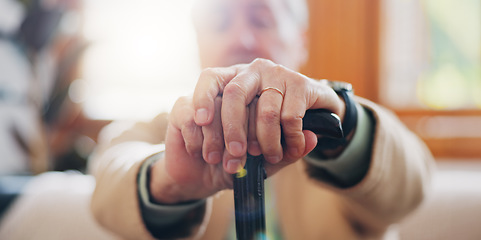 Image showing Walking stick, hands and senior man with a disability in home, apartment or retirement with support for injury. Elderly, closeup or person with wood cane to help balance or mobility with arthritis