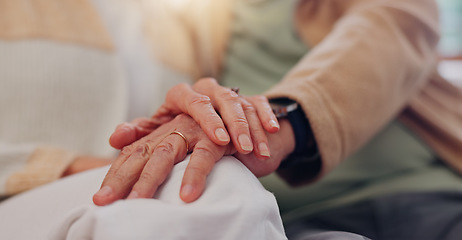 Image showing Hands, support and a senior couple closeup in their home for love, sympathy or trust during retirement. Hope, healing and empathy with elderly people on a sofa in the living room of their home