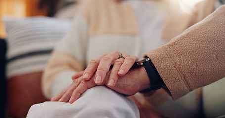Image showing Hands, support and a senior couple closeup in their home for love, sympathy or trust during retirement. Hope, healing and empathy with elderly people on a sofa in the living room of their home