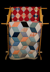 Image showing Two Quilts On A Rack