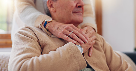 Image showing Hands, empathy and a senior couple closeup in their home for love, support or trust during retirement. Hope, healing and sympathy with elderly people on a sofa in the living room of their home