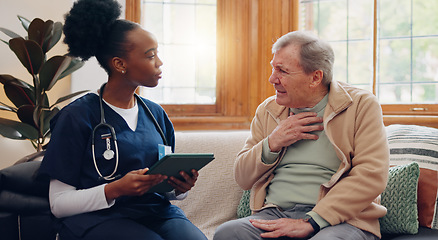 Image showing Healthcare, tablet and a senior man with a caregiver during a home visit for medical checkup in retirement. Technology, medicine and appointment with a nurse talking to an elderly patient on the sofa