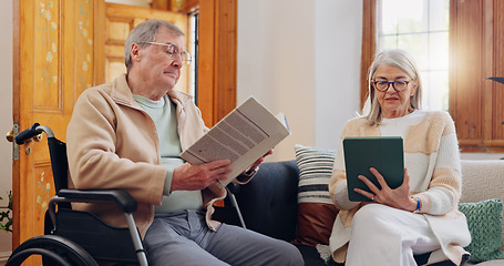 Image showing Elderly couple and care, retirement house and wheelchair in nursing home with people reading books, news or tablet with hobbies. Retirement and relax in house living room with notebook