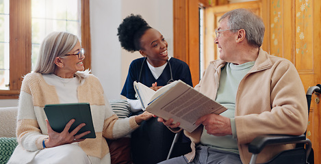 Image showing Elderly care, nurse and talking in home with people reading books, news or tablet with discussion of support. Retirement, caregiver and relax in conversation or house living room with notebook