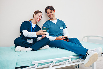 Image showing Doctor, student phone and friends on break with laughing on a hospital, healthcare and clinic bed with social media. Smile, mobile and happy young people with rest from medical and nursing internship