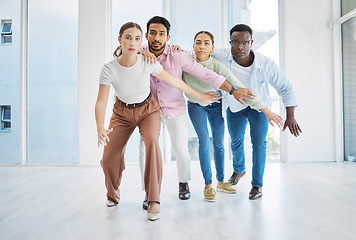 Image showing Team building, startup and together for activity in office for collaboration, strategy or work. Diverse group, man and woman with serious, face and unity with pose for game, partnership or synergy