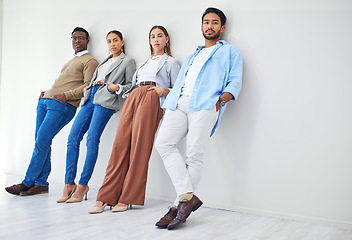 Image showing Creative designer, staff and business people with portrait and hiring employee group in a office. Job interview, recruitment and leaning on wall with diversity and company team or serious worker