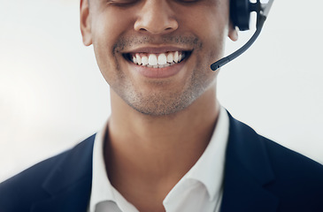 Image showing Call center, face and man consulting for crm, customer support and telemarketing sales closeup. Customer service, contact us and consultant, happy and smile about sale, e commerce and management