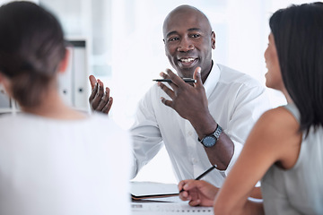 Image showing Meeting, discussion and team working on a project together in a modern office conference room. Teamwork, collaboration and professional black man talking to his colleagues in the workplace boardroom.