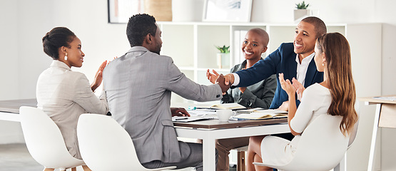 Image showing Business people, handshake and meeting applause in collaboration for corporate idea or strategy at the office. Group of employee workers shaking hands in b2b, partnership or teamwork at the workplace