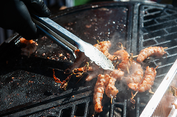 Image showing A professional cook prepares shrimps