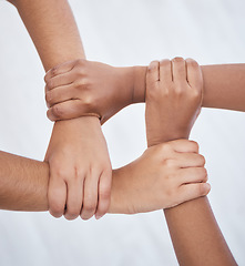 Image showing Hands, collaboration and joined people holding hands for unity, solidarity and connection. Community, support and teamwork with colleagues working together. Union, partnership and motivated people