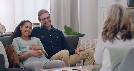 Image showing Happy, counseling and couple with a psychologist in an office for a therapy session together. Happiness, pregnant woman and her husband talking to a professional family therapist with a smile.