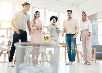 Image showing Work, friends and paper game for team building fun and bonding with office garbage in workplace. Aim, target and happiness of workers enjoying goofy trash throw challenge on break together.