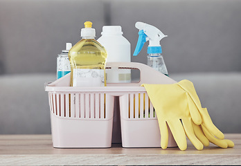 Image showing Cleaning container, spray bottle or rubber gloves on table in house, home or hotel living room for bacteria protection cleaner service. Zoom, housekeeping or healthcare hygiene product in maintenance