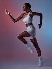 Image showing Black woman, runner and exercise for health, wellness and workout with studio background. Female athlete, healthy trainer or focus for body warm up, running or training for cardio, fitness or balance