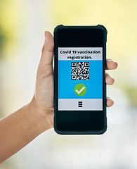 Image showing Hand, vaccination and qr code on app on a phone for registration for travel safety or protection. Covid vaccine, barcode and digital certificate on cellphone for healthcare compliance during pandemic